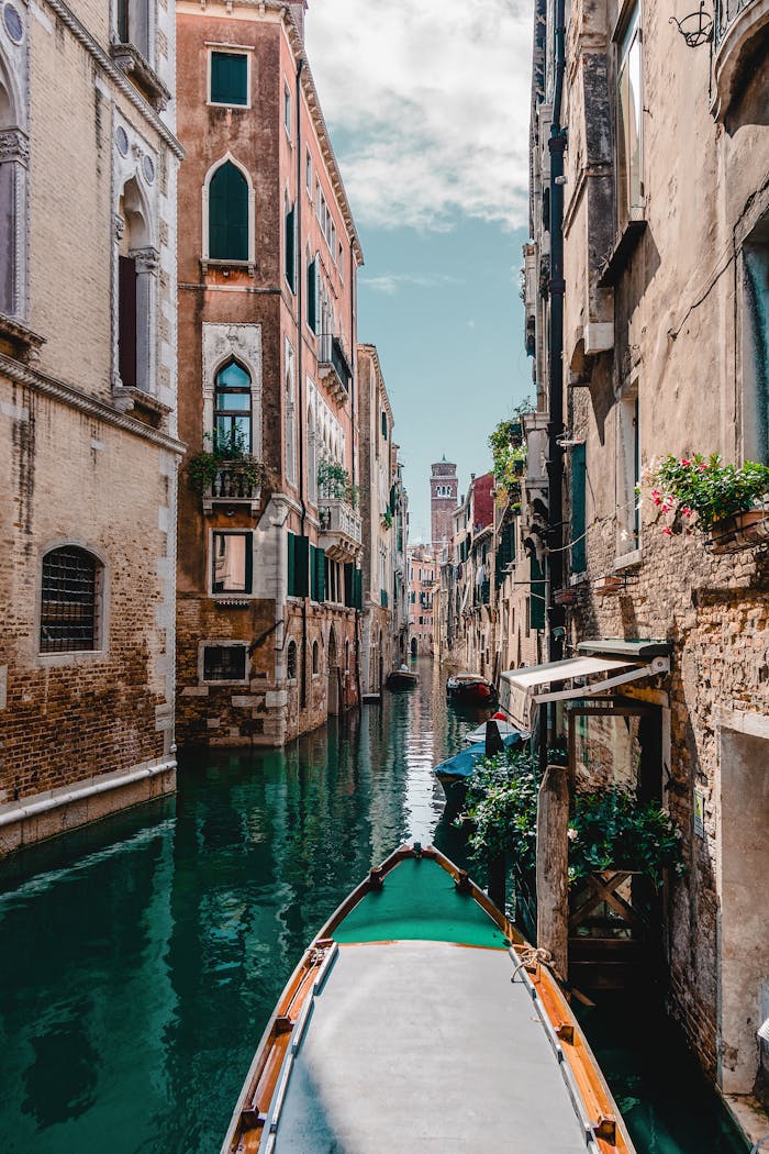 Services Captivating view of a traditional Venetian canal surrounded by historic buildings, perfect for travel enthusiasts.